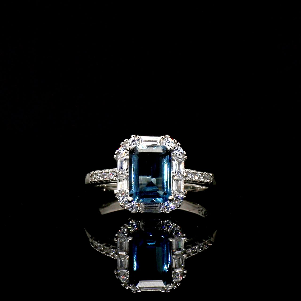 Emerald-Cut Blue Topaz Ring with Halo Setting